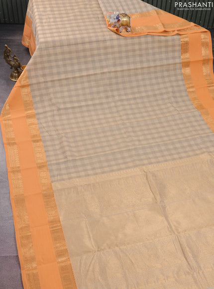 Kanchi cotton saree beige and peach orange with allover thread checked pattern and rettapet zari woven border