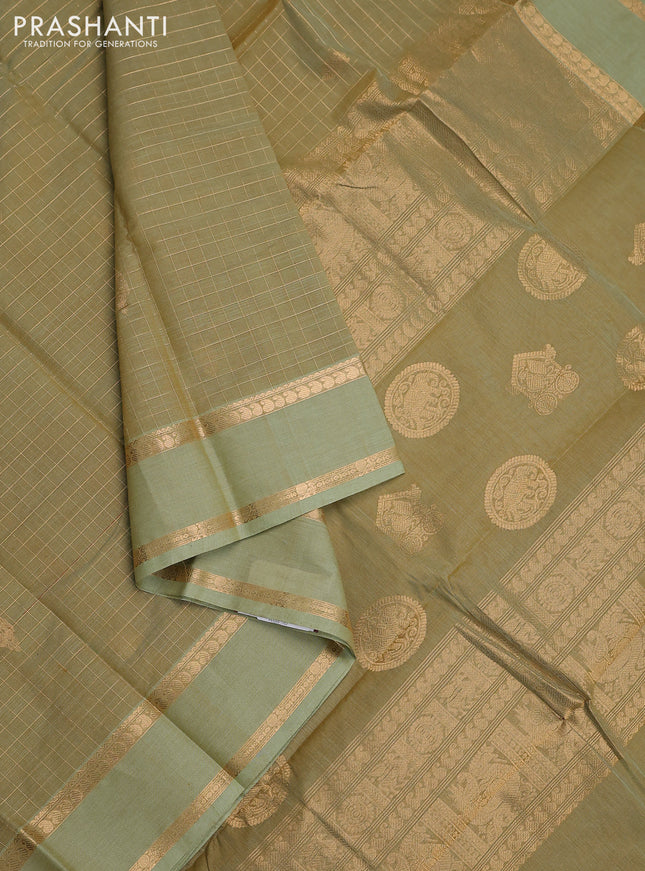 Kanchi cotton saree pastel green with allover zari checked pattern and rettapet zari woven border