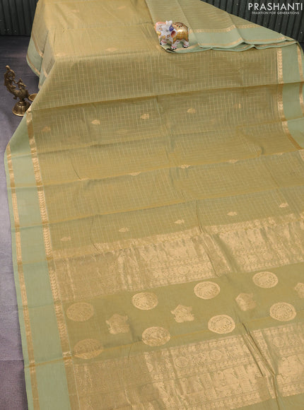 Kanchi cotton saree pastel green with allover zari checked pattern and rettapet zari woven border