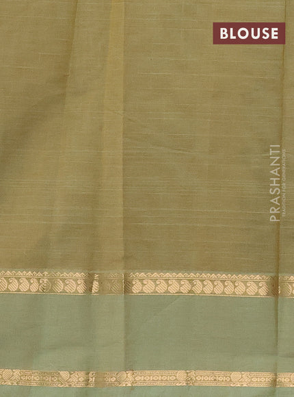 Kanchi cotton saree pastel green with allover zari checked pattern and rettapet zari woven border