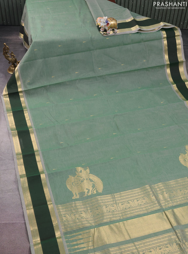 Kanchi cotton saree pastel green and dark green with plain body and rettapet zari woven border