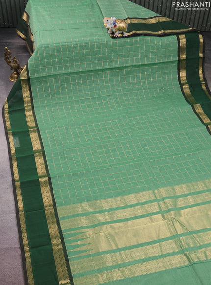 Kanchi cotton saree pastel green and dark green with allover zari checked pattern and rettapet zari woven border