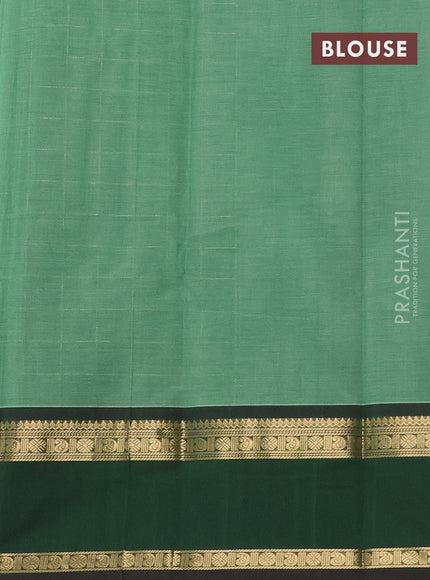 Kanchi cotton saree pastel green and dark green with allover zari checked pattern and rettapet zari woven border