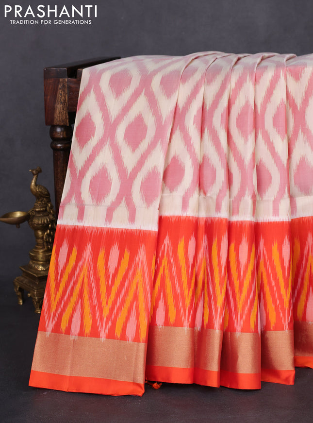 Ikat soft silk saree cream and orange with allover ikat weaves and zari woven border