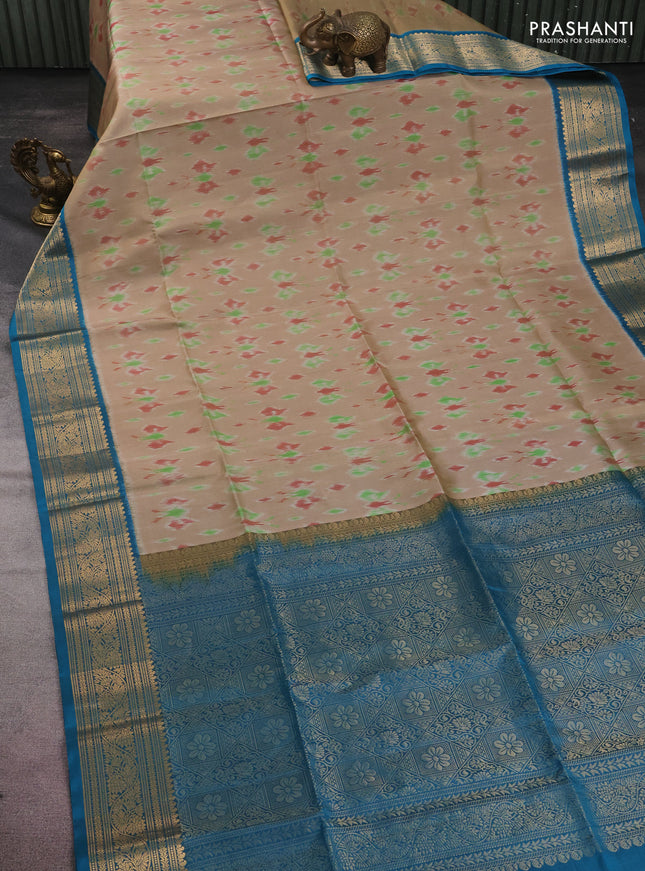Ikat soft silk saree beige and cs blue with allover ikat weaves and zari woven border