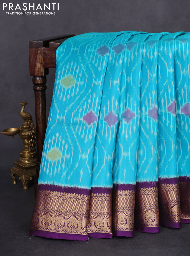 Ikat soft silk saree teal blue and violet with allover ikat weaves and zari woven border