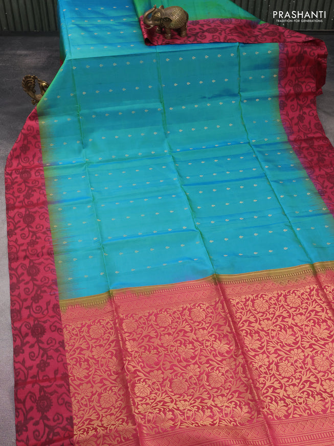 Ikat soft silk saree dual shade of teal bluish green and pink shade with allover zari woven buttas and ikat style border