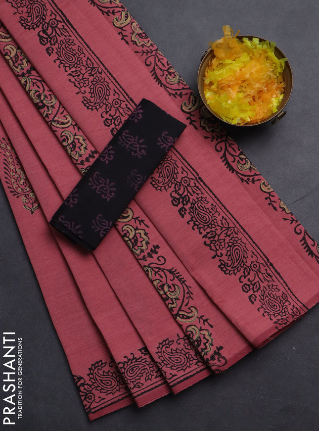 Semi silk cotton saree peach shade and black with butta prints and printed border