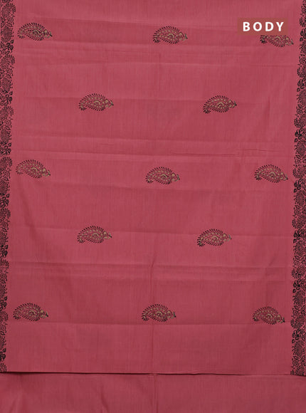 Semi silk cotton saree peach shade and black with butta prints and printed border