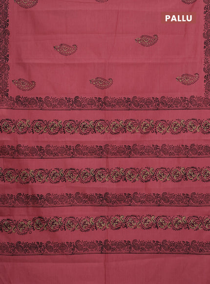 Semi silk cotton saree peach shade and black with butta prints and printed border