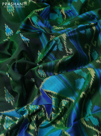 Rajkot patola silk saree green with allover ikat butta weaves and zari woven border
