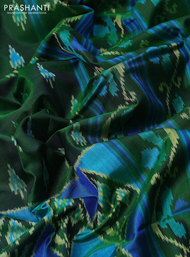 Rajkot patola silk saree green with allover ikat butta weaves and zari woven border