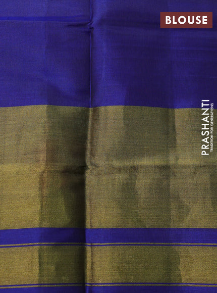 Rajkot patola silk saree dual shade of dark mustard and blue with allover ikat weaves and long zari woven border
