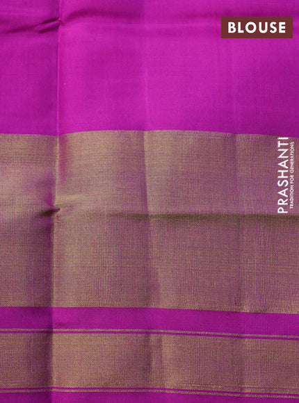 Rajkot patola silk saree dual shade of mustard yellow and purple with allover ikat weaves and long zari woven border