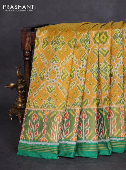 Rajkot patola silk saree mustard yellow and green with allover ikat weaves and long zari woven border