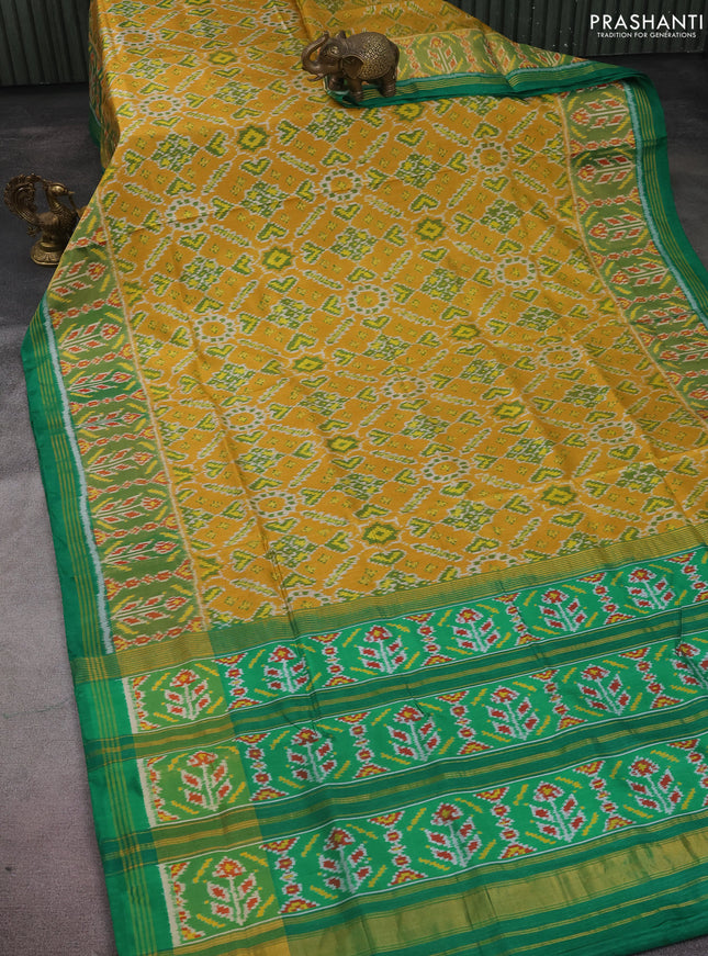 Rajkot patola silk saree mustard yellow and green with allover ikat weaves and long zari woven border