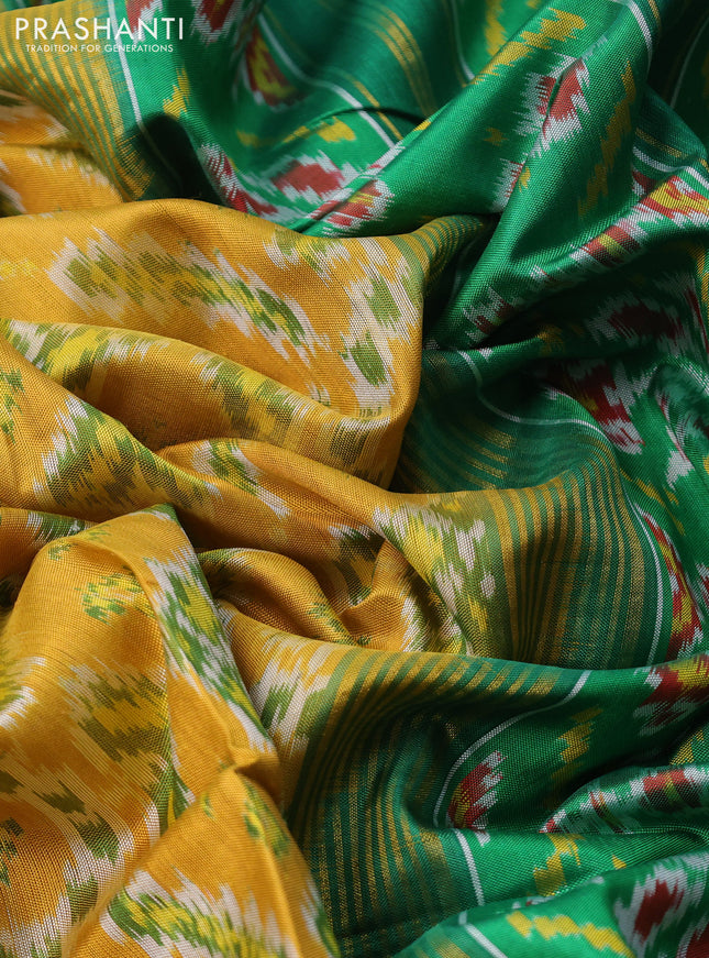 Rajkot patola silk saree mustard yellow and green with allover ikat weaves and long zari woven border