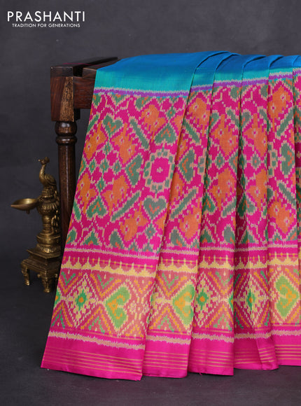 Rajkot patola silk saree teal blue and pink with plain body and long zari woven border