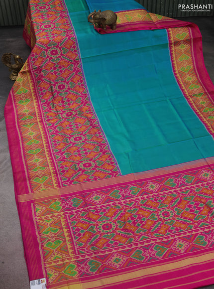 Rajkot patola silk saree teal blue and pink with plain body and long zari woven border