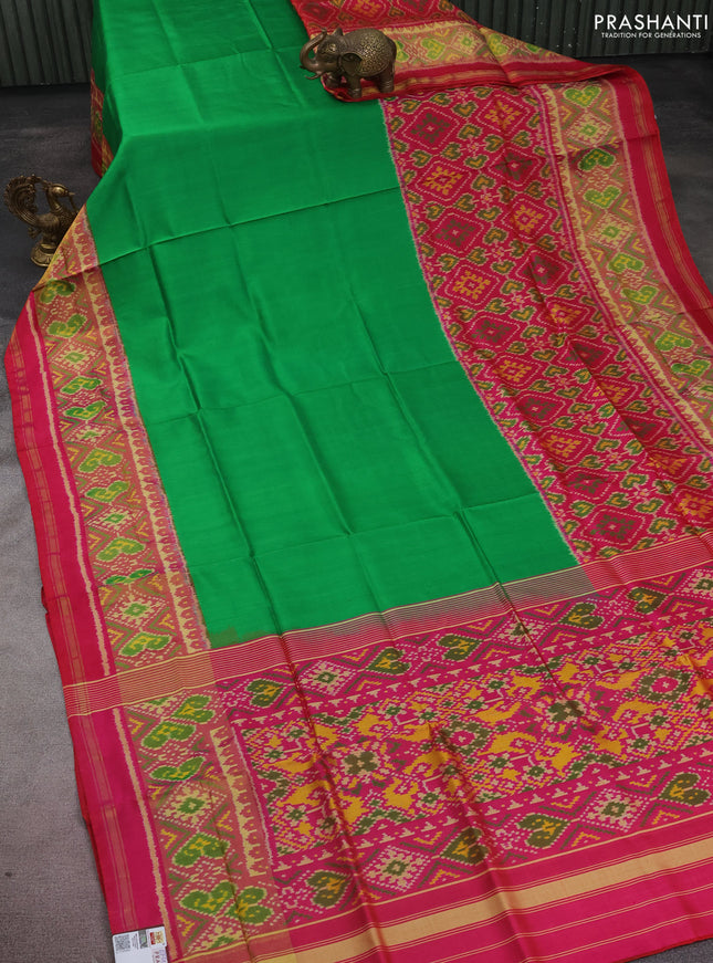 Rajkot patola silk saree light green and pink with plain body and long zari woven border