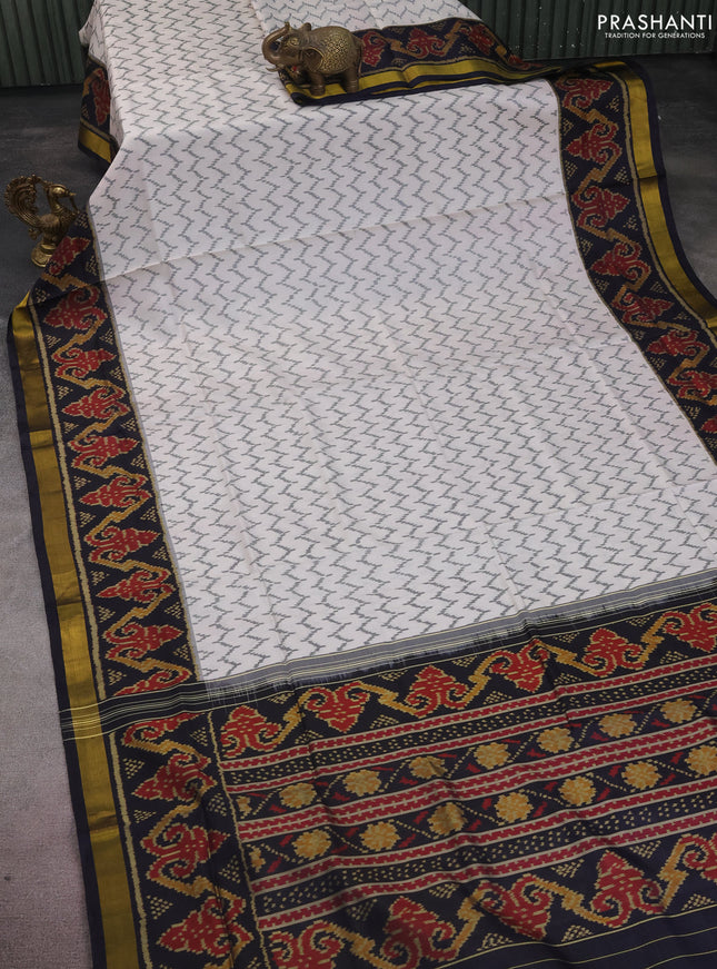Rajkot patola silk saree off white and black with allover ikat weaves and zari woven border