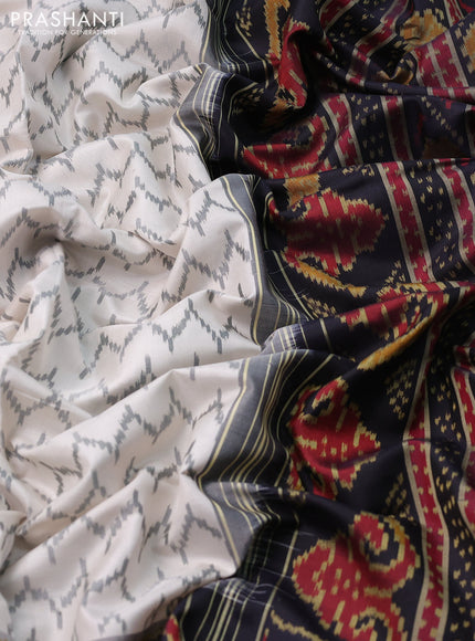 Rajkot patola silk saree off white and black with allover ikat weaves and zari woven border