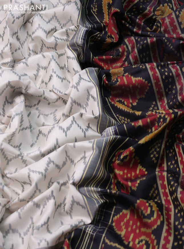 Rajkot patola silk saree off white and black with allover ikat weaves and zari woven border