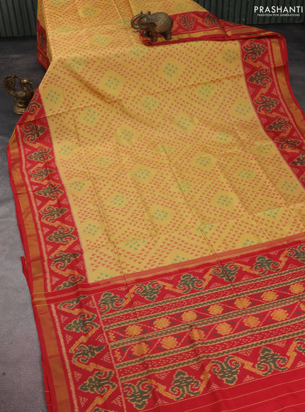 Rajkot patola silk saree pale yellow and red with allover ikat weaves and zari woven border