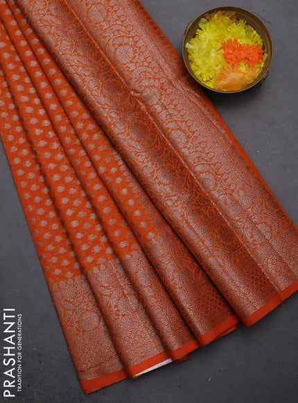 Semi chiniya saree orange with woven buttas and woven border