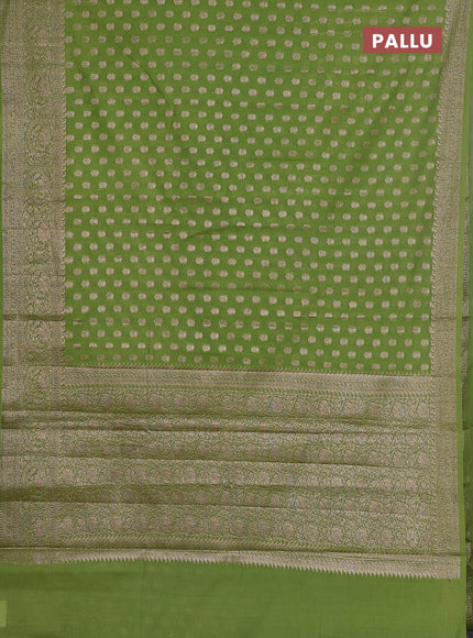 Semi chiniya saree light green with woven buttas and woven border