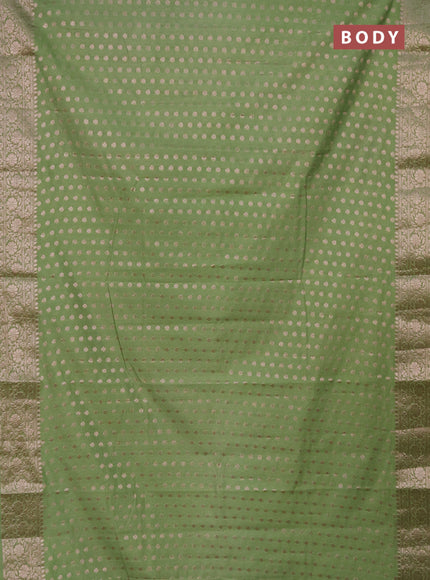 Semi chiniya saree pastel green with woven buttas and woven border