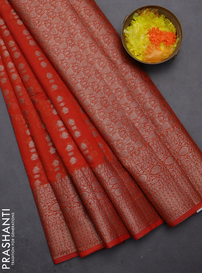 Semi chiniya saree orange with woven buttas and woven border