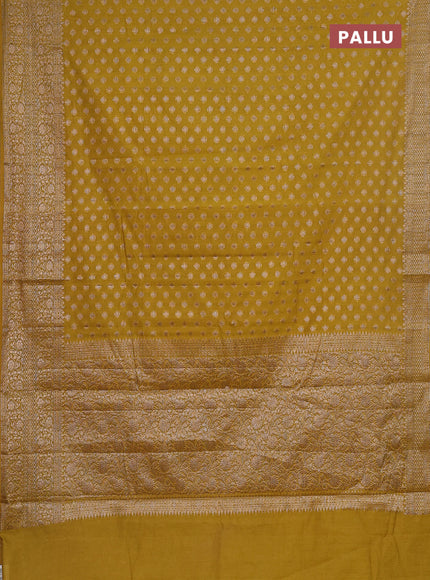 Semi chiniya saree yellow with woven buttas and woven border