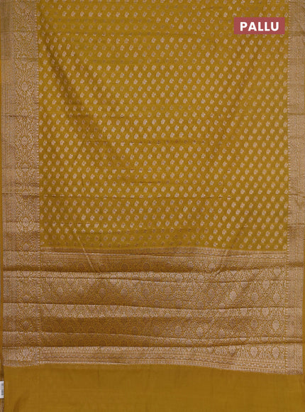 Semi chiniya saree mustard shade with woven buttas and woven border