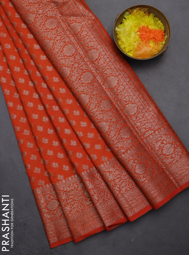 Semi chiniya saree orange with woven buttas and woven border
