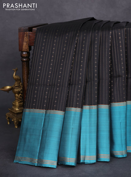 Pure soft silk saree black and teal blue with allover zari weaves and rettapet zari woven border