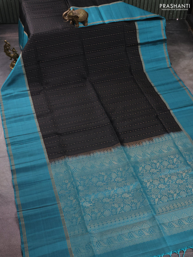 Pure soft silk saree black and teal blue with allover zari weaves and rettapet zari woven border