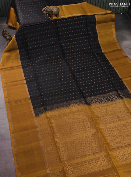 Pure soft silk saree black and dark mustard with allover zari woven buttas and long rettapet zari woven border