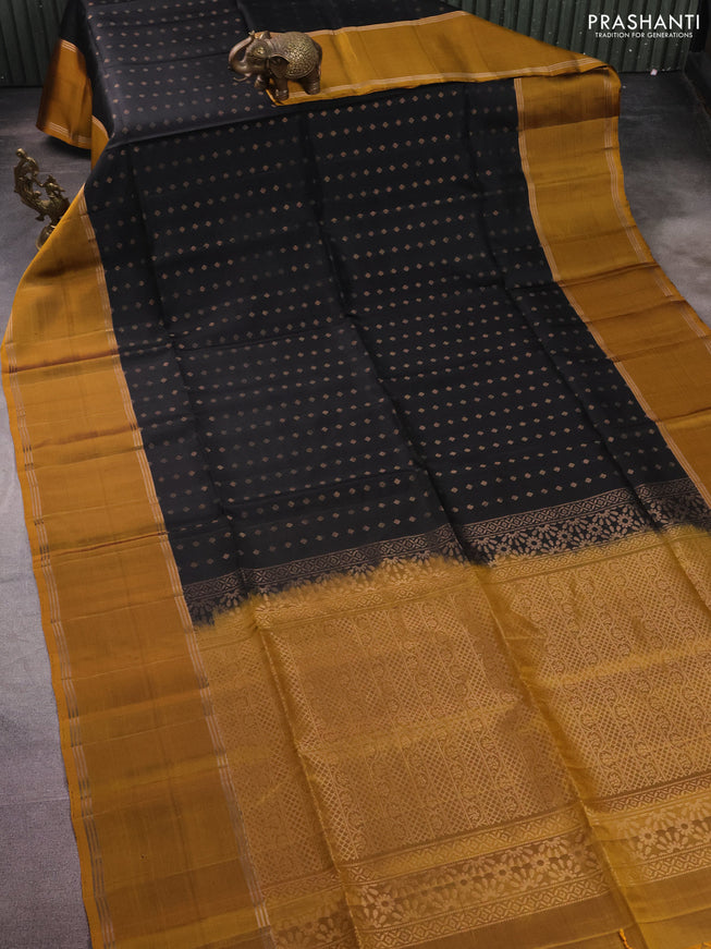 Pure soft silk saree black and dark mustard with allover zari woven buttas and long rettapet zari woven border