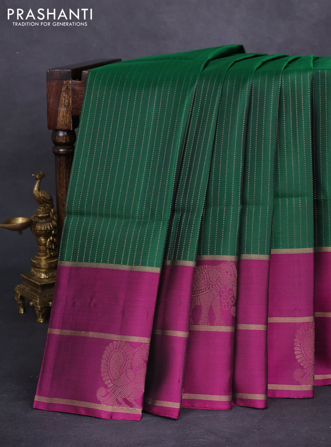 Pure soft silk saree green and purple with allover zari stripe pattern and long zari woven butta border