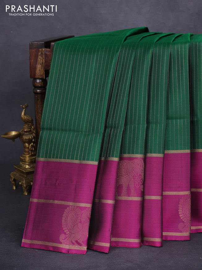 Pure soft silk saree green and purple with allover zari stripe pattern and long zari woven butta border