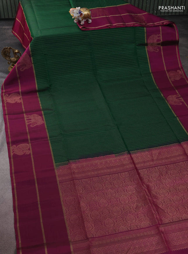 Pure soft silk saree green and purple with allover zari stripe pattern and long zari woven butta border