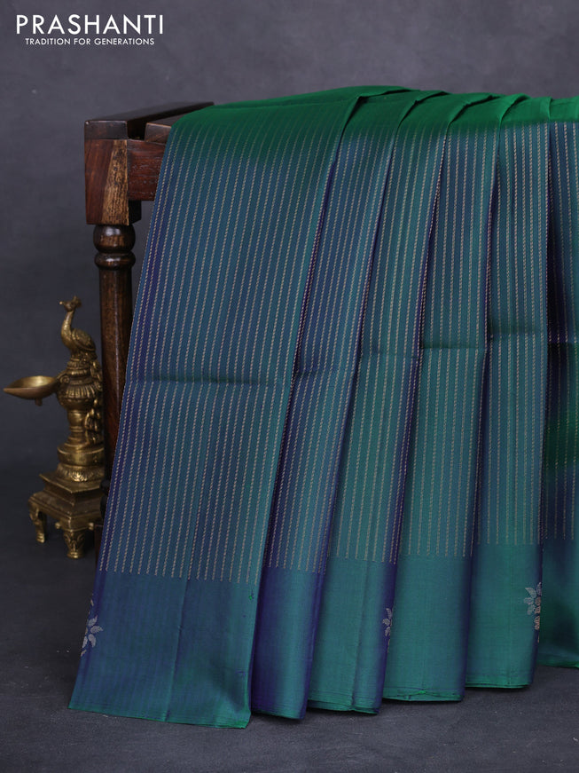 Pure soft silk saree dual shade of bluish green with allover zari weaves and zari woven floral butta border