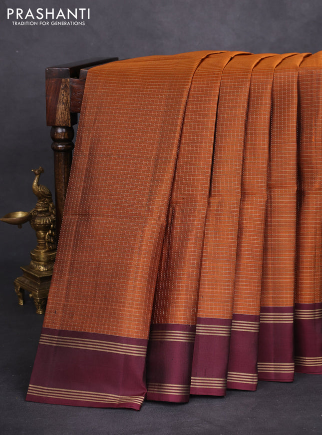 Pure soft silk saree rust shade and deep maroon wth allover zari checked pattern and rettapet zari woven border