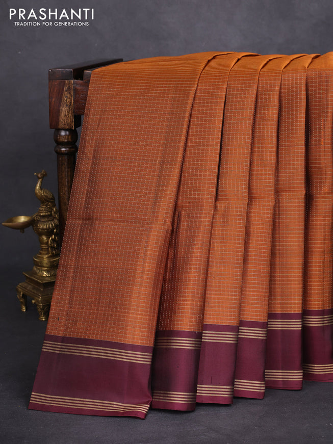 Pure soft silk saree rust shade and deep maroon wth allover zari checked pattern and rettapet zari woven border