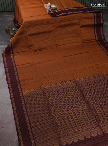 Pure soft silk saree rust shade and deep maroon wth allover zari checked pattern and rettapet zari woven border