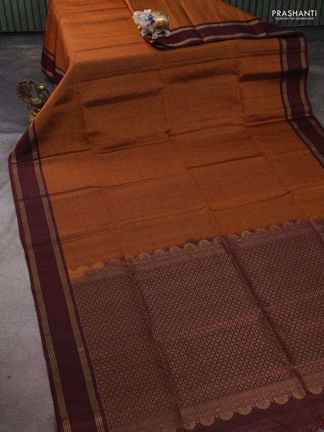 Pure soft silk saree rust shade and deep maroon wth allover zari checked pattern and rettapet zari woven border