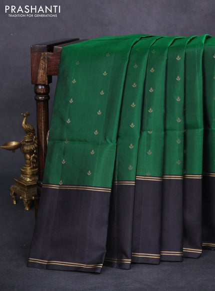 Pure soft silk saree green and black with allover zari woven buttas and rettapet zari woven border