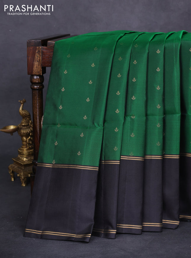 Pure soft silk saree green and black with allover zari woven buttas and rettapet zari woven border