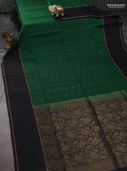 Pure soft silk saree green and black with allover zari woven buttas and rettapet zari woven border